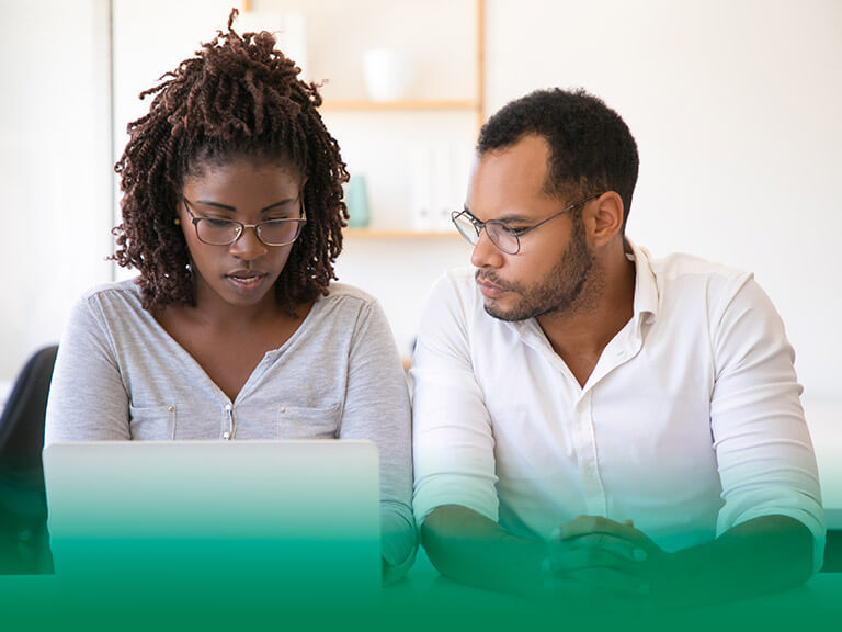 The Debt Centre | Debts Help & Advice | Sequestration | Young Couple WIth Laptop